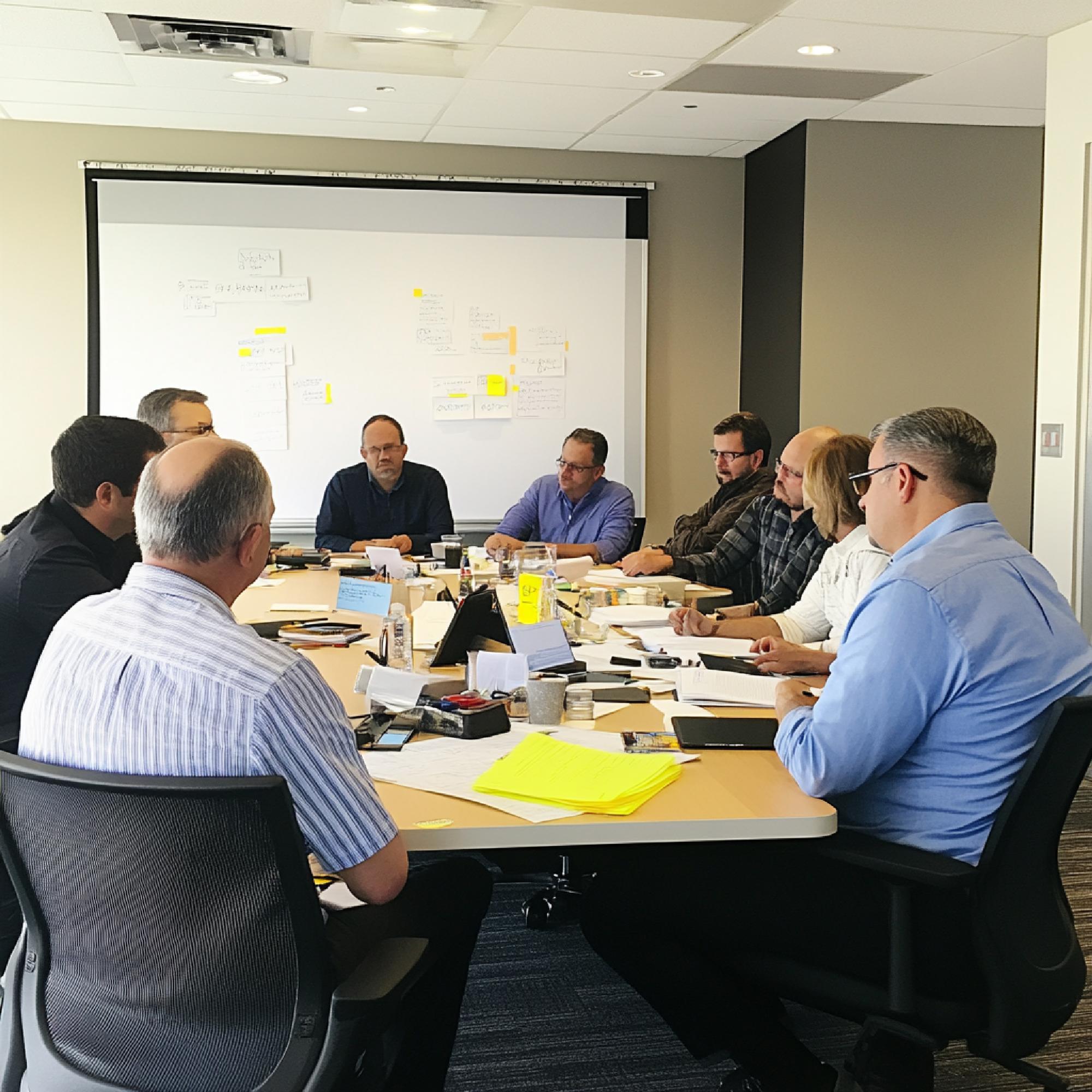 Business advisory experts analyzing market data and developing tailored solutions for clients